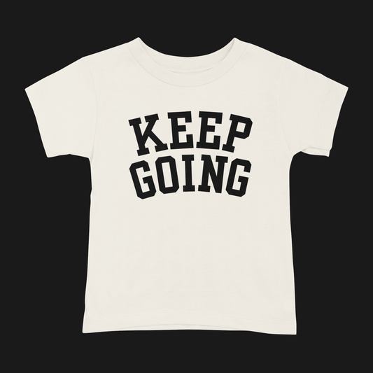 Cream t-shirt with 'KEEP GOING' text on a black background