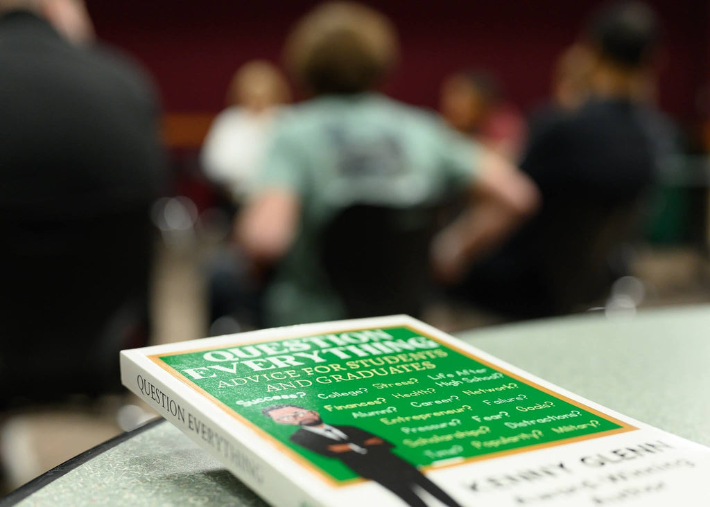 Question Everything book displayed at a student event